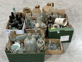 A collection of old bottles and jars.