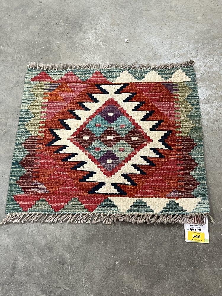 A Chobi Kilim rug. 0.44m x 0.48m.