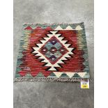 A Chobi Kilim rug. 0.44m x 0.48m.