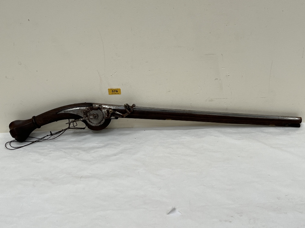 A wheellock musket with walnut stock. 34" long
