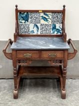 A Victorian Arts and Crafts washstand with tiles by or in the manner of William de Morgan.