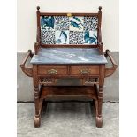 A Victorian Arts and Crafts washstand with tiles by or in the manner of William de Morgan.