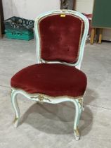 An antique French Louis XV salon chair on cabriole legs.