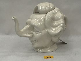 A Margaret Thatcher character teapot. 8¼" high.