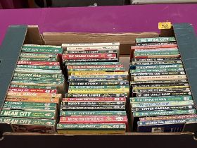 A box of Corgi paperbacks.