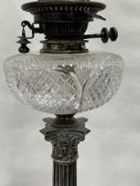 A Victorian plated corinthian oil lamp with Hink's duplex burner and cut clear glass fount. 25½"