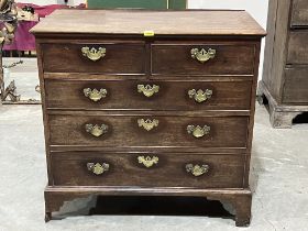 A George III mahogany chest of two short over three long drawers on bracket feet. 37" wide. Break
