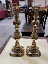 A pair of Victorian brass candlesticks. 14" high.