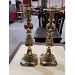 A pair of Victorian brass candlesticks. 14" high.