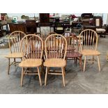 Two sets of stickback kitchen chairs.