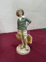 A Royal Worcester figure, French Fisherboy, modelled by James Hadley.