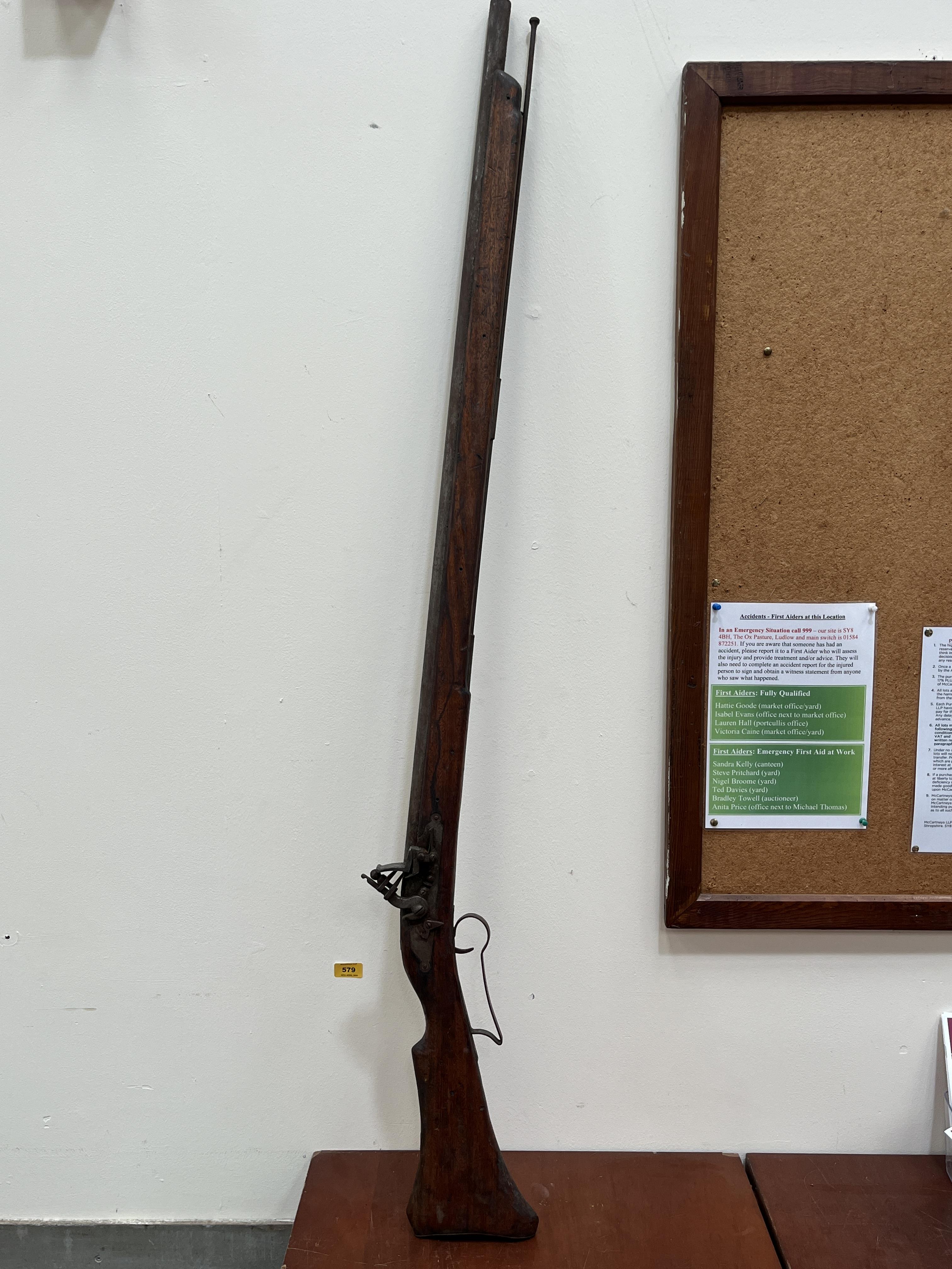 An antique flintlock musket. 58½" long.