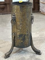 A Victorian brass embossed stick stand on sea serpent legs. 24" high.