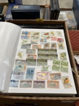 Ten albums of stamps.