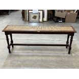 A Victorian mahogany window seat with caned seat, on turned legs. 52" wide.