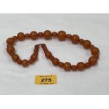 A necklace of alternating amber beads, 18½" long. 52.7g