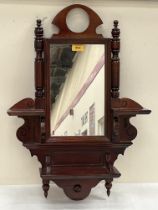 A Victorian mahogany hall mirror. 26" high.