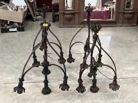 A set of four early 20th Century wrought metal hanging lamps. 31" high.