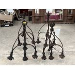 A set of four early 20th Century wrought metal hanging lamps. 31" high.