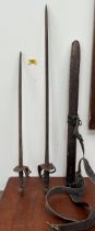 Two swept hilt swords, one with leather scabbard. 36" and 29" long.