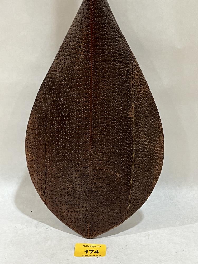A carved tribal ceremonial paddle, Raivavae, Austral Islands, French Polynesia, the pommel ringed by - Image 2 of 5
