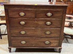 A George III mahogany chest of drawers raised on turned feet. 47" wide.