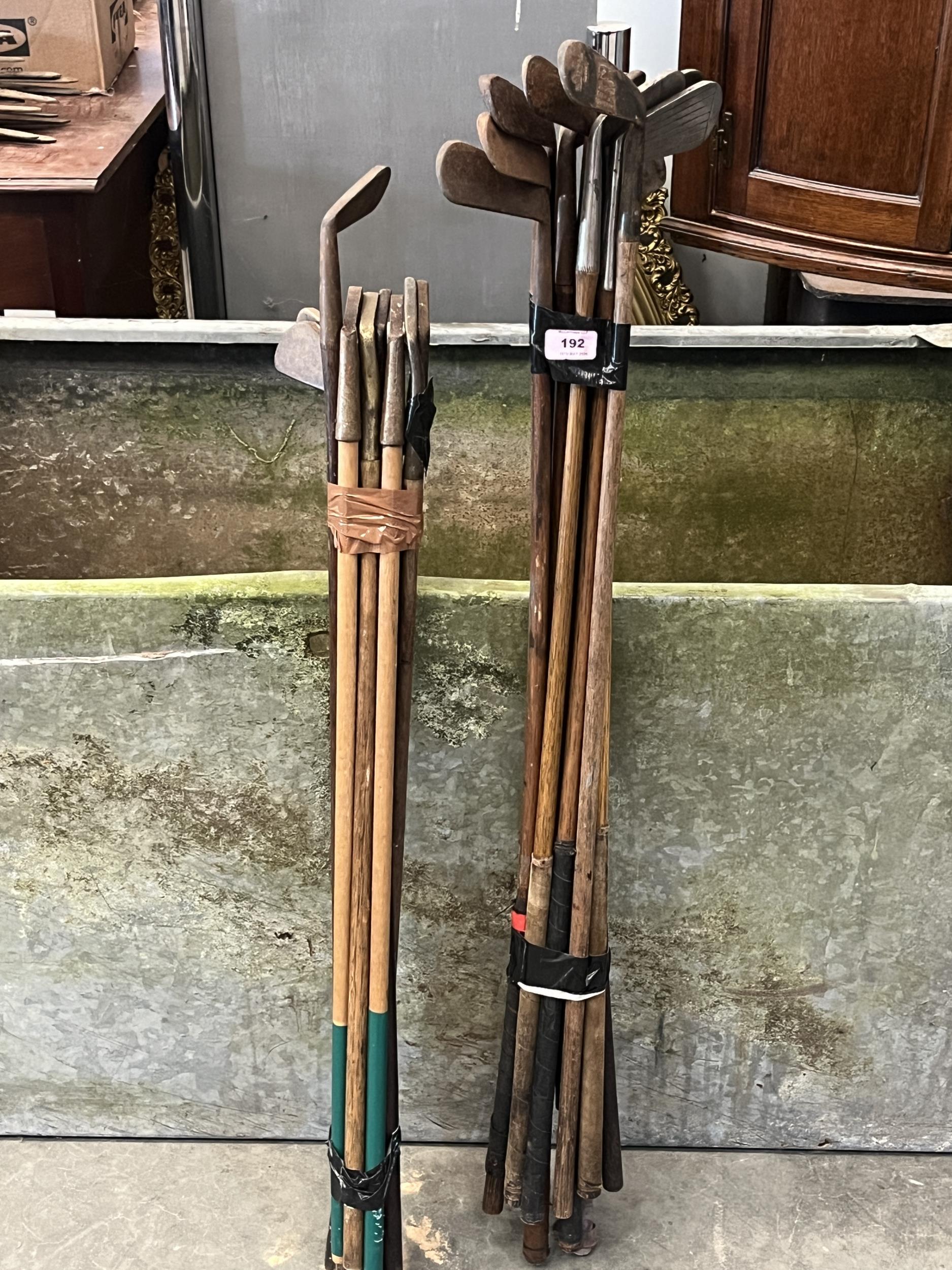 A collection of hickory shafted golf putters.