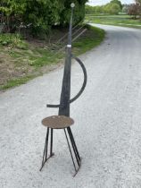 An iron chair form garden ornament. 62" high.