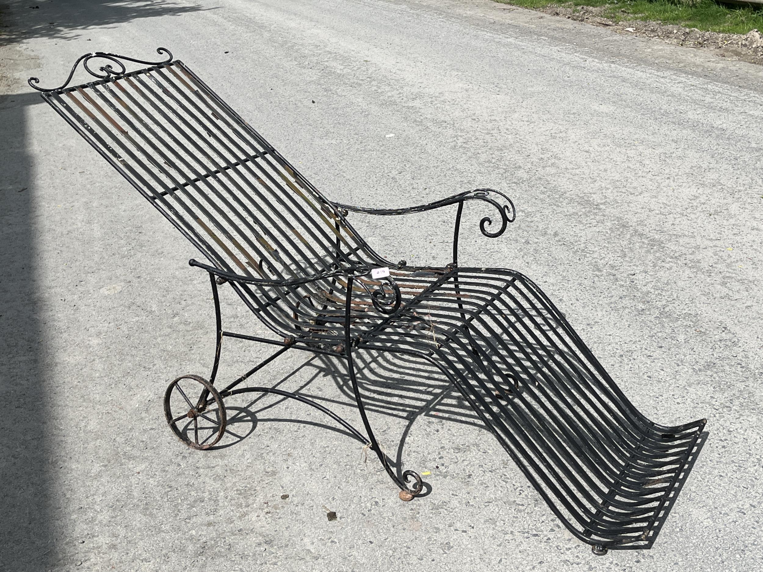 A wrought iron garden armchair.