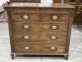 A George III mahogany chest of drawers raised on turned feet. 47" wide.