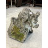 A statuary gargoyle gable end, 21" high x 22" long. Losses.