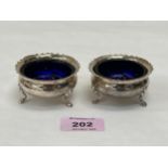 A pair of George V silver salts with blue glass liners. Chester 1926. 2ozs 14dwts.