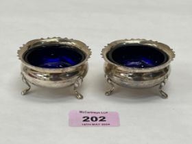 A pair of George V silver salts with blue glass liners. Chester 1926. 2ozs 14dwts.