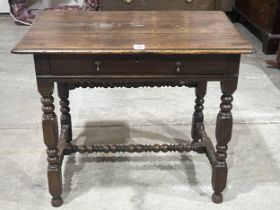 A William III and later joined oak side table with frieze drawer, on bobbin turned and square