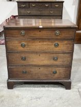 A George III mahogany chest of four long drawers, on bracket feet. 39" wide.