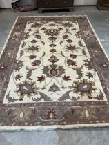 A cream ground Afghan carpet. 138" x 92"