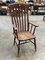 A Victorian lath-back kitchen armchair.