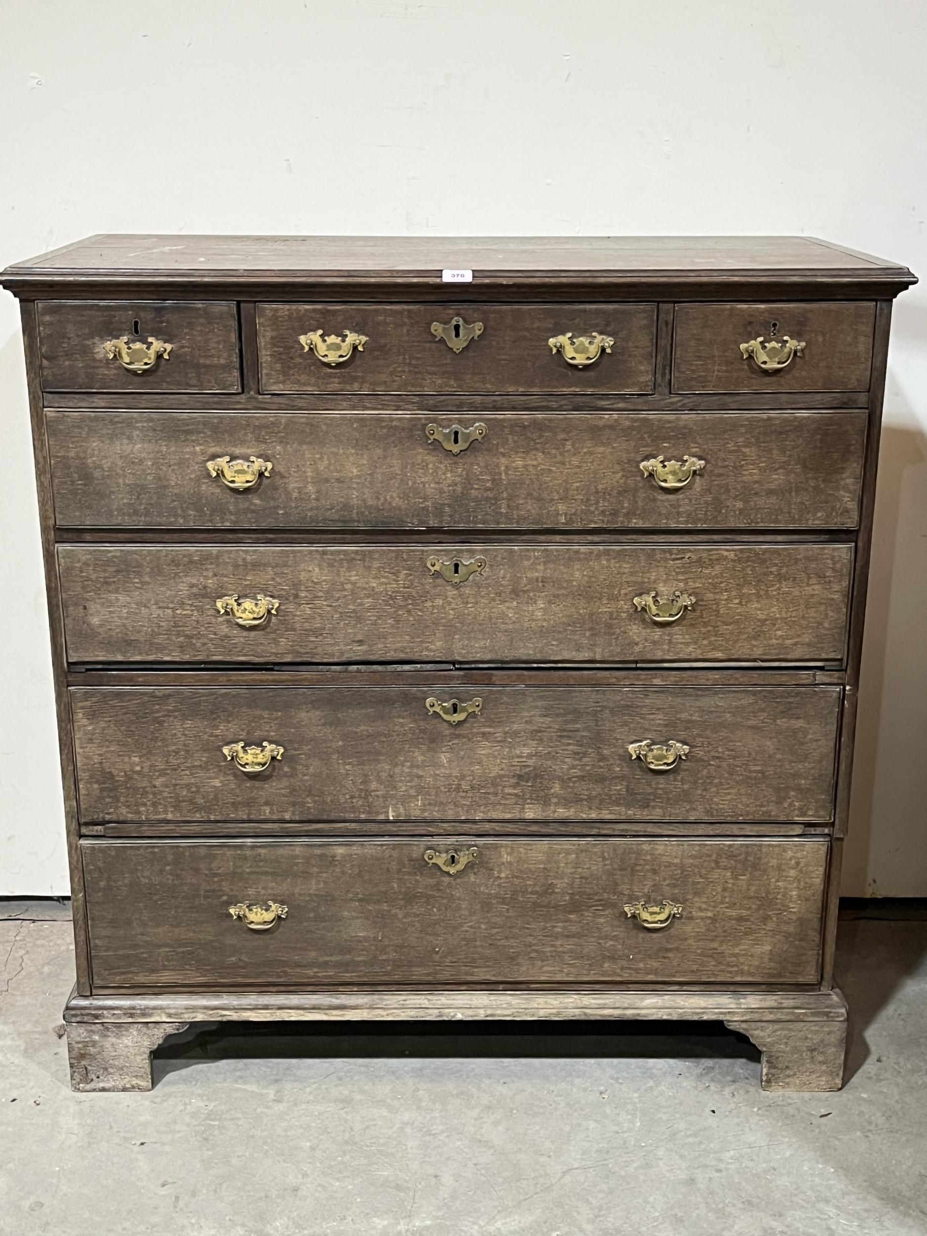 An 18th Century chest of three short over four long drawers, on bracket feet. 48"w x 50"h.