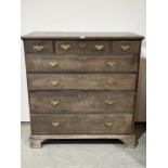 An 18th Century chest of three short over four long drawers, on bracket feet. 48"w x 50"h.
