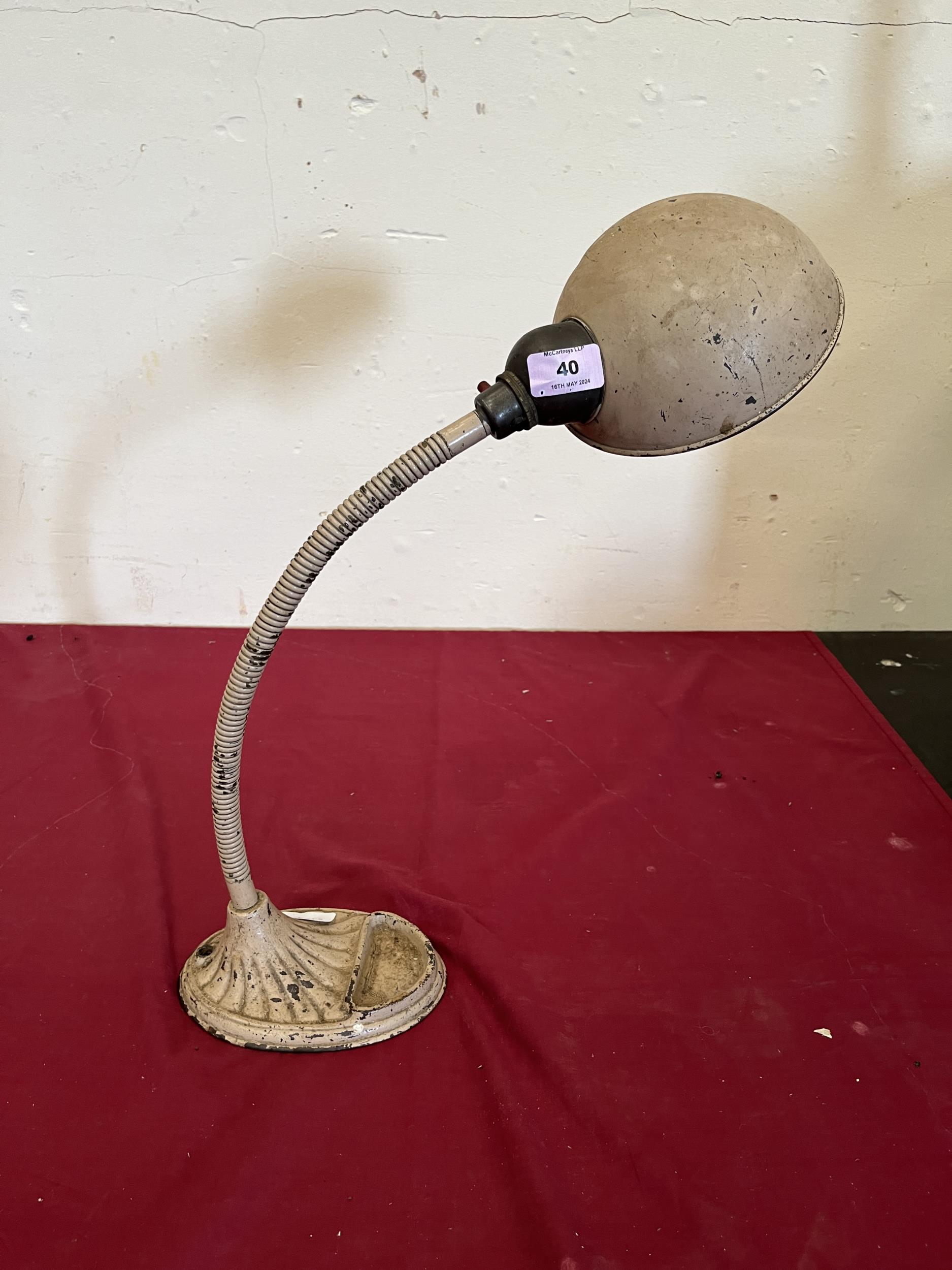 A 1930s 'Supreme' painted iron desk lamp.