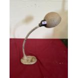 A 1930s 'Supreme' painted iron desk lamp.