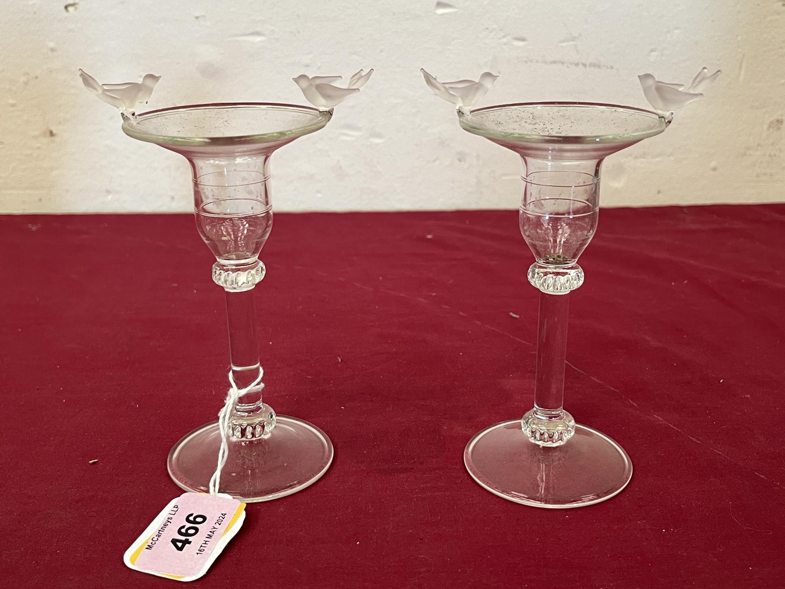 A pair of glass candlesticks, the rims applied with frosted glass birds. 5¼" high.