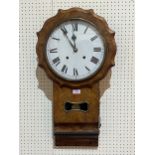 A 19th Century walnut drop-cased wall clock, the movement striking the hours on a bell. 29" high.
