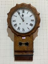 A 19th Century walnut drop-cased wall clock, the movement striking the hours on a bell. 29" high.