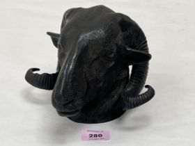 A bronze ram"s head wall mask. 5½" high.