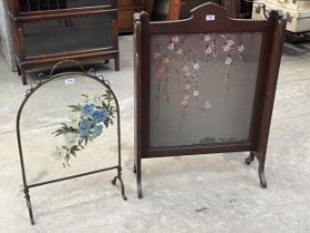 An early 20th Century oak firescreen with embroidered silk banner, 37" high; together with a painted