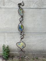 A wrought iron and glass garden ornament 99" high.