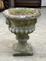 A campana form garden vase of square foot. 18" high.