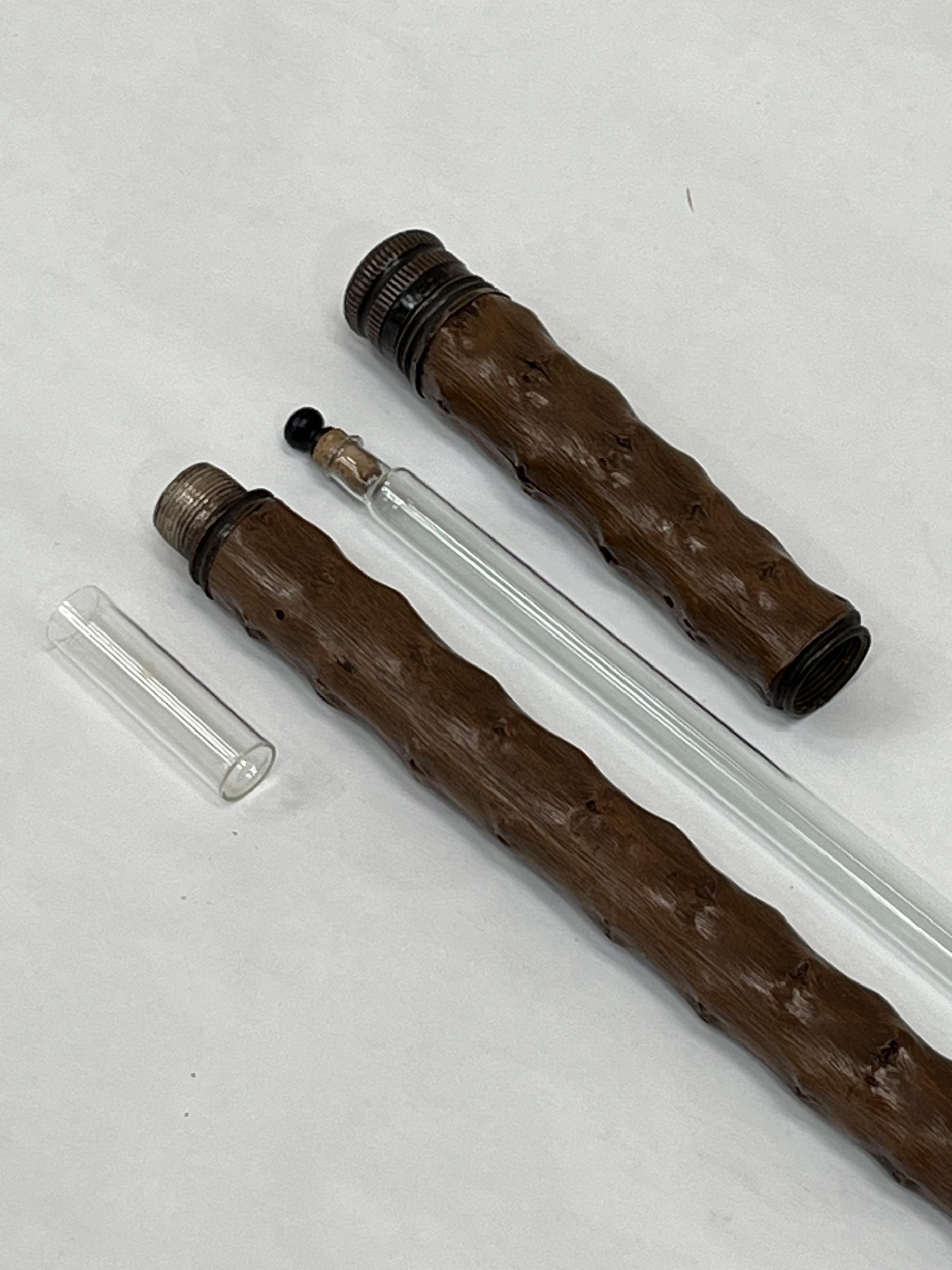 A 19th Century walking cane with screw compartments for a glass bottle and drinking glass. 36" - Image 2 of 2