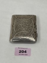 An Edward VII silver foliate engraved cigarette case. Birmingham 1904. 2ozs 12dwts.